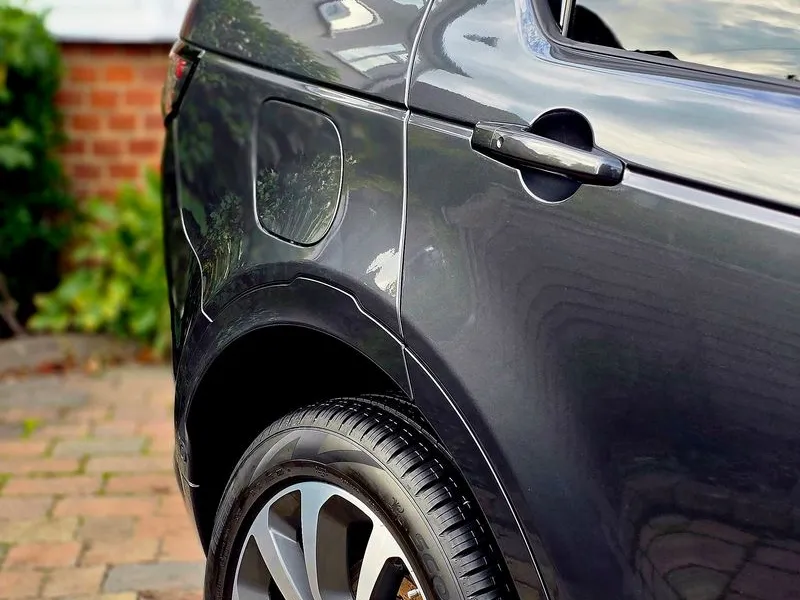 Glossy dark grey Land Rover exterior rear quarter view