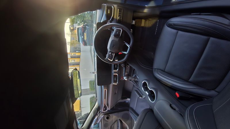 Ford Mustang driver side interior with black leather seats