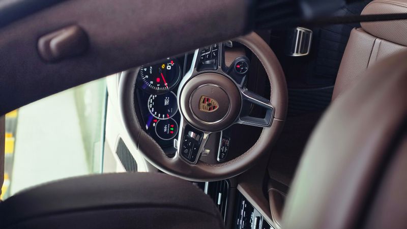 Porsche 911 GT3 interior showing steering wheel and instrument cluster