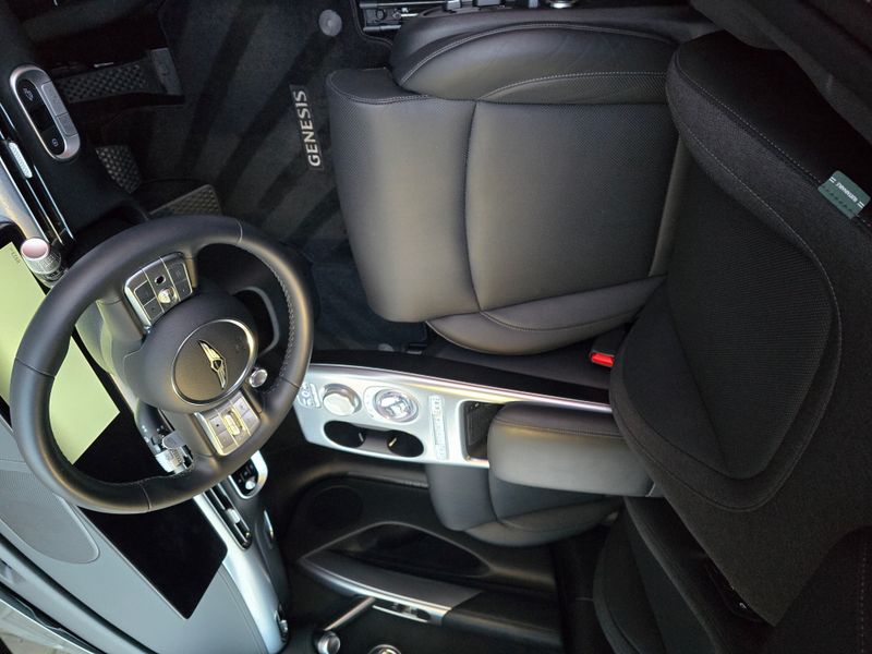 Genesis interior, looking down at driver seat and steering wheel